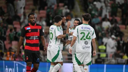 Al Ahli's stars celebrate one of five goals v Al Riyadh