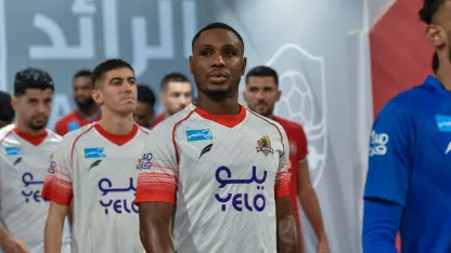Odion Ighalo (C) in the pre-match line-up for Al Wehda