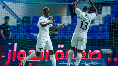 Knowledge Musona (L) celebrates his goal for Al Okhdood v Al Fateh