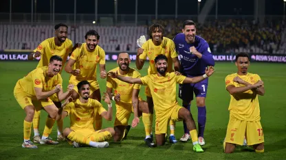 Al Qadsiah players celebrate beating Al Wehda
