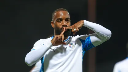 Alexandre Lacazette celebrates goal for NEOM SC at Damac