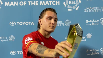 Al Qadsiah's Mateo Retegui picks up his Man of the Match award v Al Khaleej