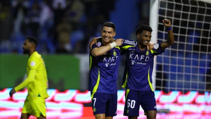 Al Nassr captain Cristiano Ronaldo celebrates Saad Haqawi's assist v Al Khaleej
