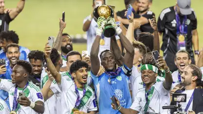 Al Ahli goalkeeper Edouard Mendy lifts the Saudi Super Cup
