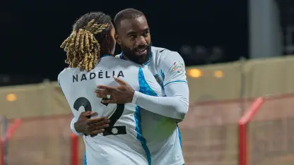 NEOM SC's Saimon Bouabre and Alexandre Lacazette celebrate goal at Damac