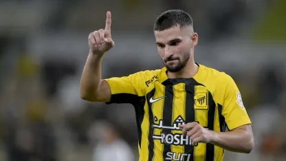 Houssem Aouar celebrates scoring for Al Ittihad v Al Fateh