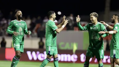 Roberto Firmino and Riyad Mahrez celebrate Al Tai v Al Ahli RSL 2023-24 MW21