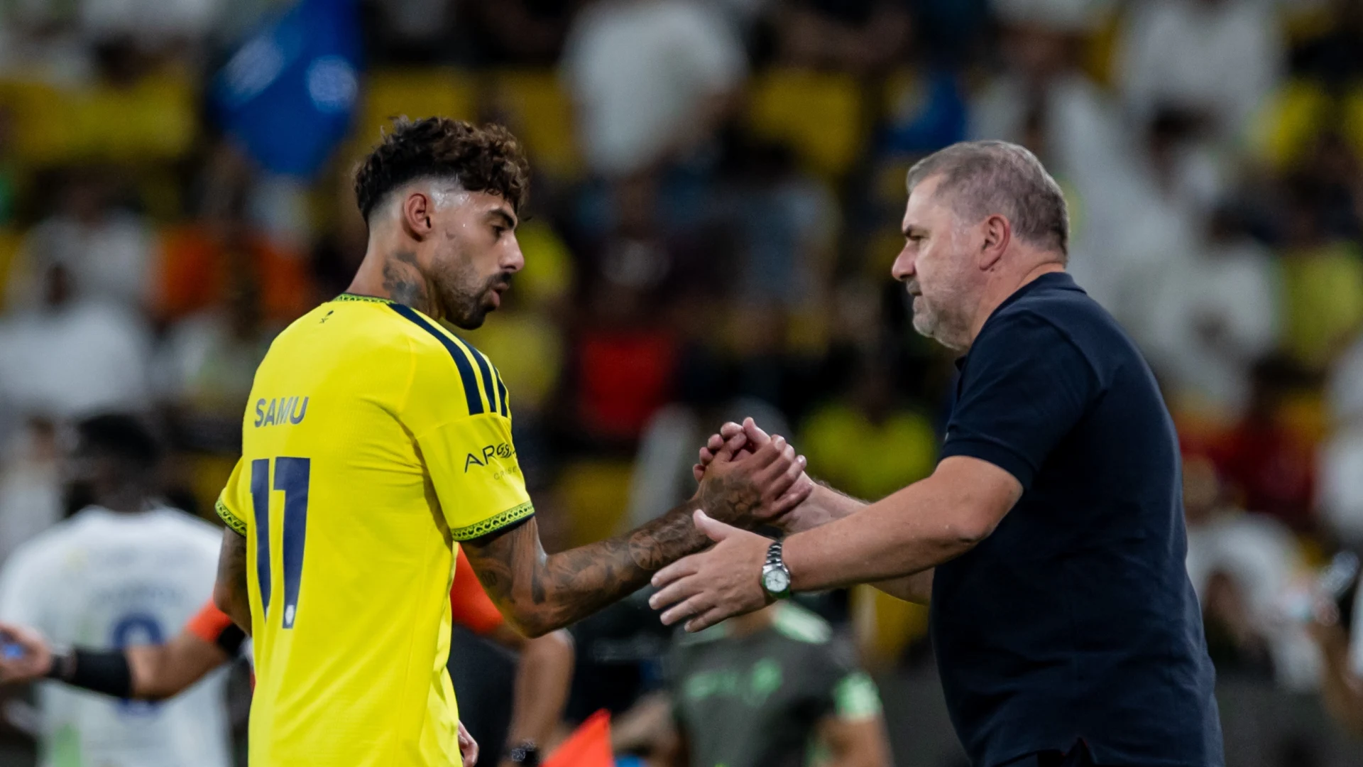 Al Nassr manager Ange Postecoglou congratulates latest signing Samu Costa on goal against Al Fateh