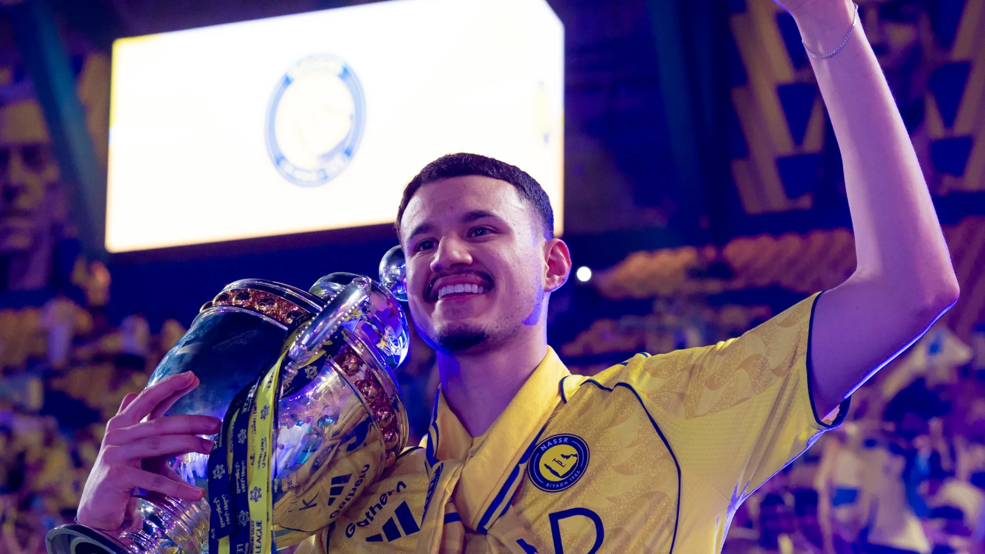 Al Nassr's Abdullah Al Hamdan with the 2025-26 RSL trophy