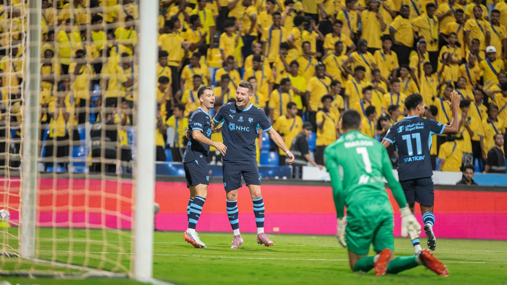 Gabriel Martnelli and teammates celebrate his first goal for Al Hilal, scoring at Al Taawoun