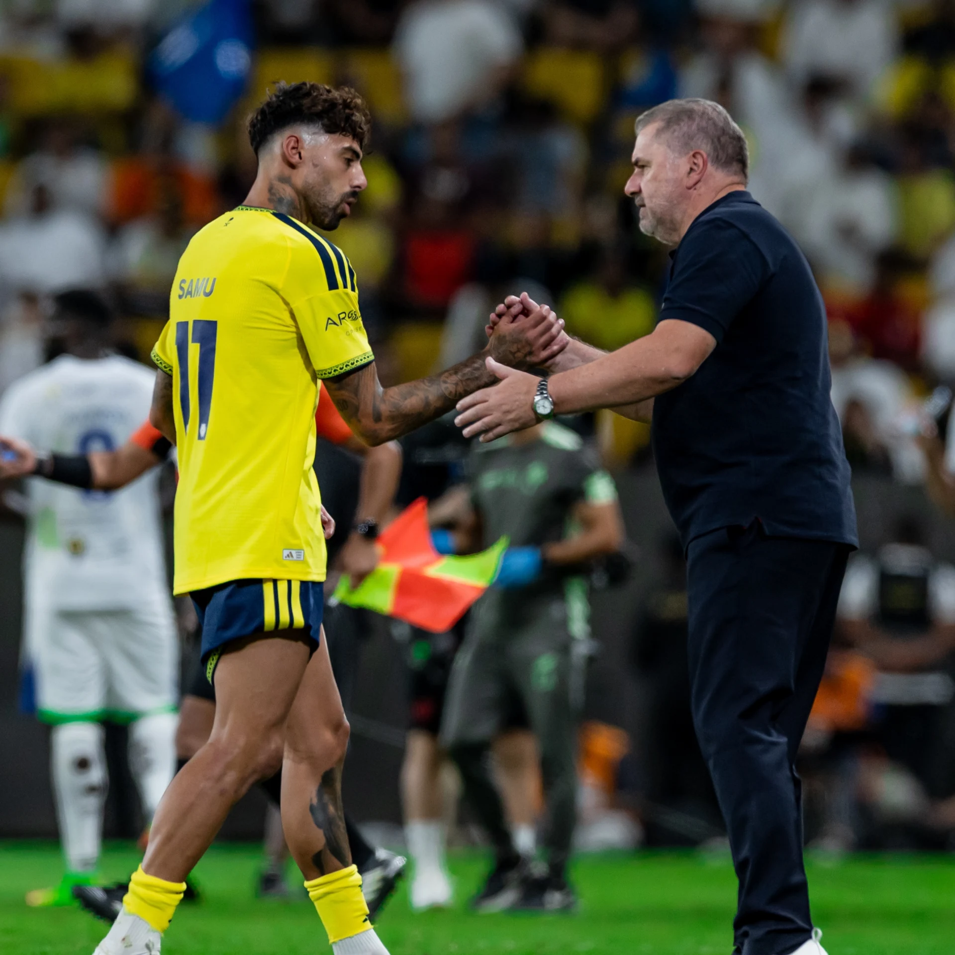 Al Nassr manager Ange Postecoglou congratulates latest signing Samu Costa on goal against Al Fateh